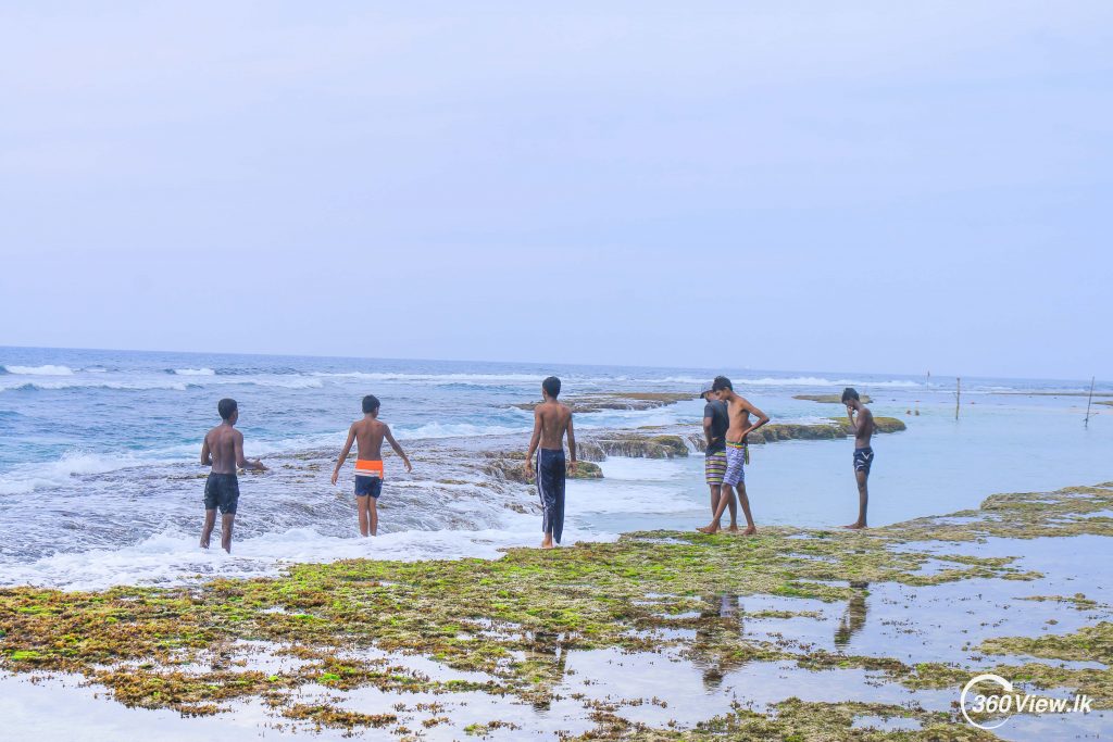 people ready to bath in  Thalpe Beach 