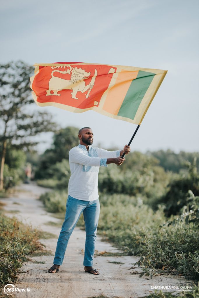 Man Waving Sri Lanka National Flag 