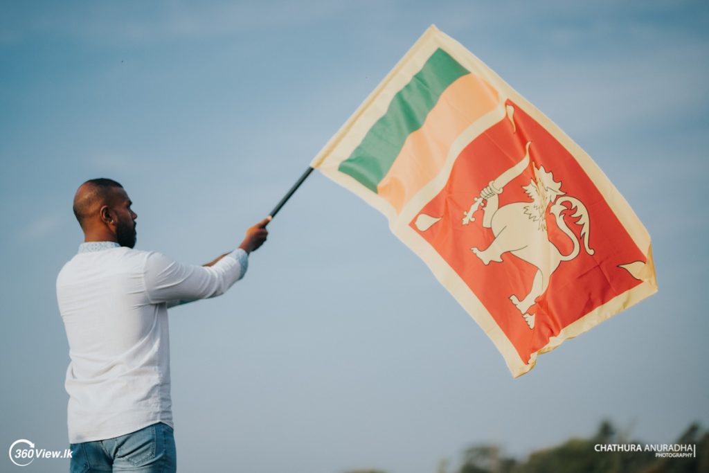 Man Waving Sri Lanka National Flag Sinha Kodiya Jathika Kodiya